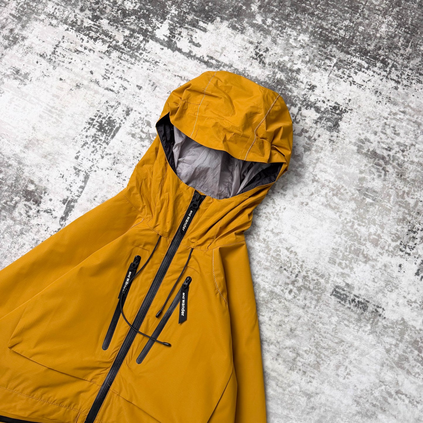 And Wander E Vent Drop Pocket Rain Jacket (L)