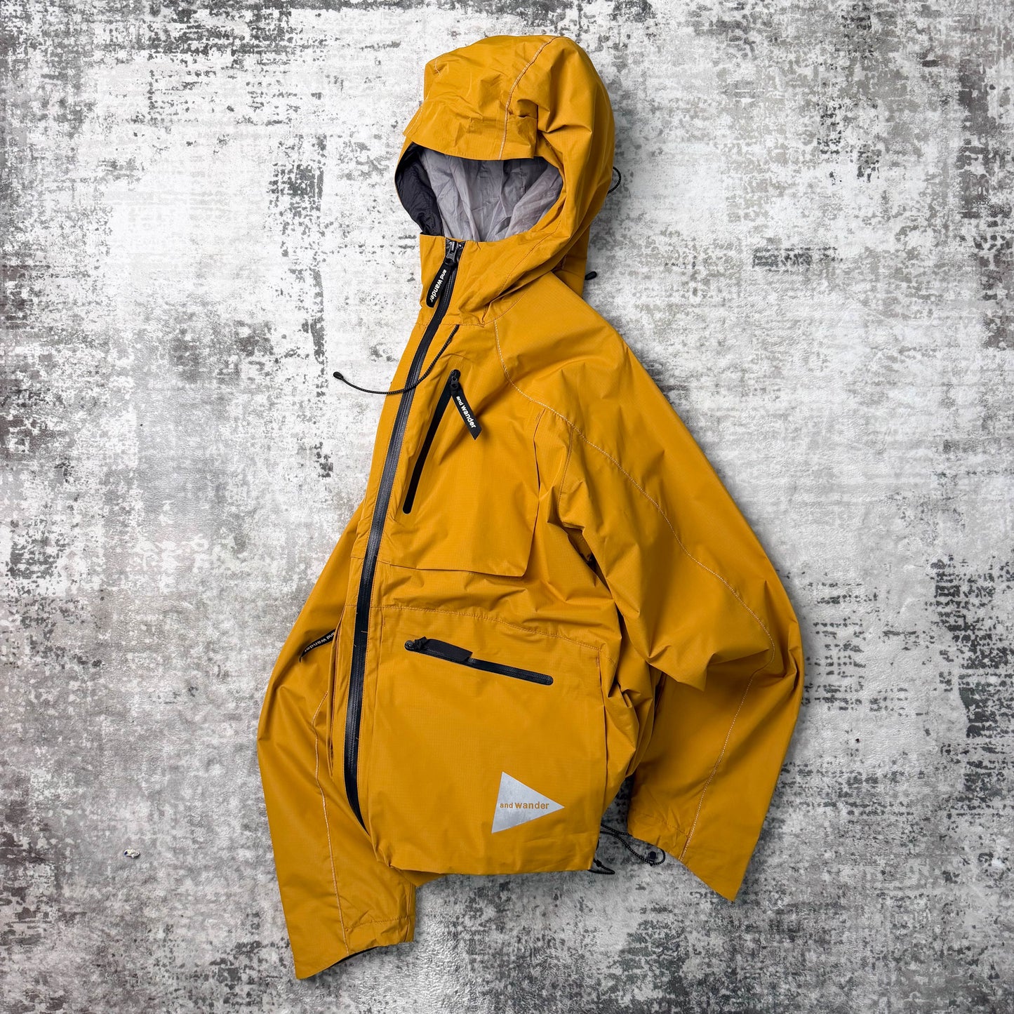And Wander E Vent Drop Pocket Rain Jacket (L)